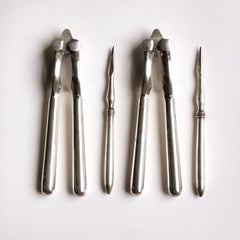 A good boxed set of vintage silver-plated nut crackers and nut picks.  Our vintage silver-plated EPNS (electro-plated nickel silver) nut crackers and picks are both good-looking and functional, and their renewed popularity make them a cool addition on today’s table. Length of nut crackers 14cm Country of origin: UK Date of manufacture: c.1930 Material: EPNS (electro-plated nickel silver) Condition: pristine - probably never used.