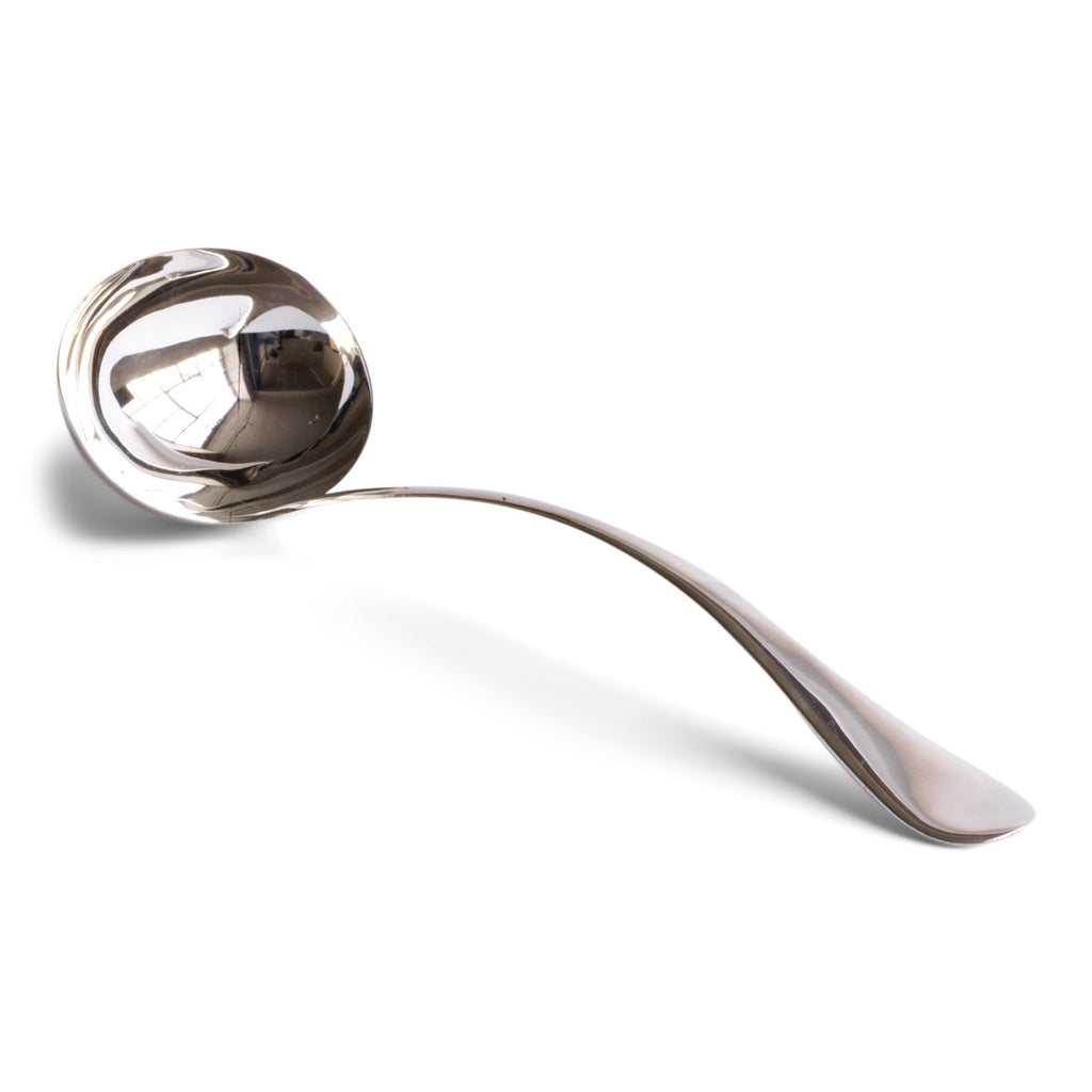A large silver-plated ladle  This well-proportioned and beautifully designed ladle has an elegant bow-arched handle and would sit well alongside a tureen of soup or bowl of festive punch. Our vintage silver-plated EPNS (electro-plated nickel silver) spoons and ladles are both good-looking and functional, and their renewed popularity make them a stylish addition on today’s table.