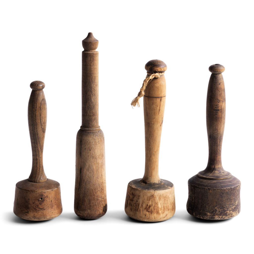 A collection of particularly pleasing antique turned wooden pestles. Now retired from their original use, they would make wonderful decorative objects for the home, and their century of use has given each a beautiful patina.