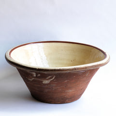A very good-looking late nineteenth century bread proving bowl with a cream coloured glazed interior and a deep rolled rim.  The delightful glaze smudges on its terracotta exterior add character - and hand-thrown charm. Perfect for the kitchen or the dining table. We think wonderful when filled with vegetables or lettuces.