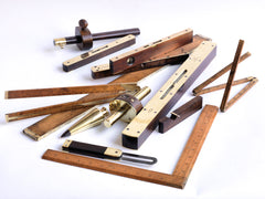 A wonderful collection of handmade 1930s vintage and antique brass bound carpenter's tools by Chesterman, Rabone & Sons of Birmingham, and Preston & Sons of Sheffield; including marking and mortice gauges, plumb bobs, hinged and extending rules, rulers, and brass plated spirit levels. All in excellent condition, with beautiful patina and in good working order.