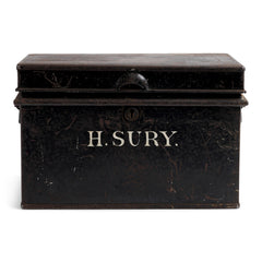 A beautifully proportioned Edwardian document tin with its original lettering "H.Sury" and black paint finish. It has a hinged lid and twin carrying handles.