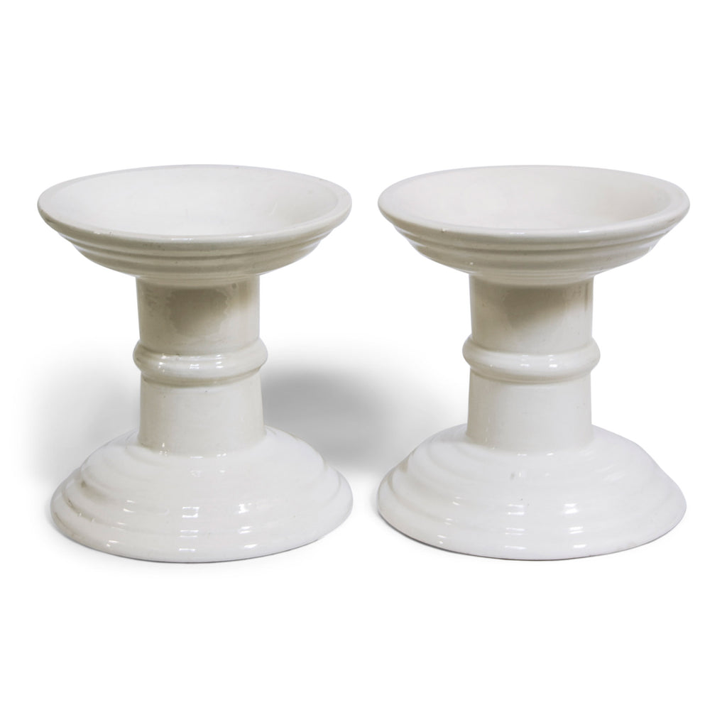 A good pair of Edwardian ironstone ham stands that would have originally graced a nineteenth century counter-service food store.  The ham was stood on top, its curve fitting into the stand's well, so it could be easily carved in situ - as well as beautifully displayed.