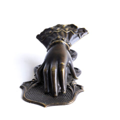 An elegant antique brass clip fashioned as a gloved hand stamped "Made in Birmingham". The back of the clip has a hole, so it can easily be hung on a wall - perfect for keeping and displaying notes, and handwritten treasures.