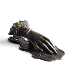 An elegant antique brass clip fashioned as a gloved hand stamped "Made in Birmingham". The back of the clip has a hole, so it can easily be hung on a wall - perfect for keeping and displaying notes, and handwritten treasures.