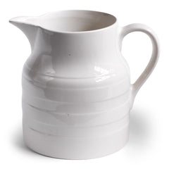 A large 1920s ironstone water jug with raised banding stamped "Lord Nelson Pottery England" to the underside of the base.