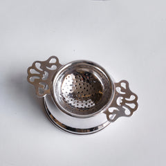 Antique silver plated tea strainer with stand