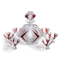 A stunning and rare Art Deco etched black and ruby glass decanter set designed by Karl Palda c.1930. The set comprises of a decanter with stopper and six conical shaped facet cut glass cocktail glasses, each with a flaring foot. Each piece is decorated with Art Deco geometric florals and red chevrons.