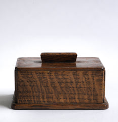 A very pleasing and handy little 1930s tabletop oak box with lid. It has a baize covered underside and so will sit comfortably on your desk or worktop.