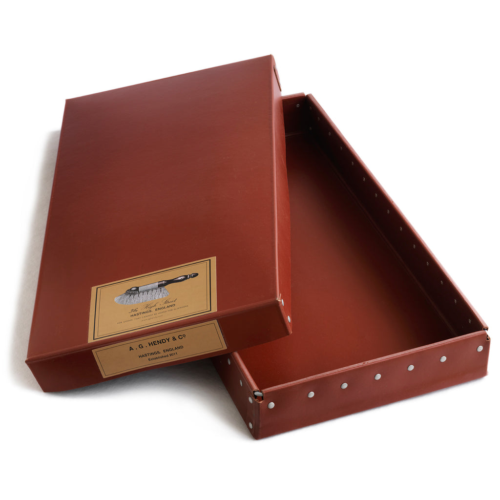 Our A G Hendy & Co branded boxes are constructed from vulcanized cardboard and have an internal aluminium frame and rivets for extra rigidity. They were originally made for a well-known central London museum in the 1950s to be used as archive boxes.