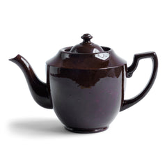 A striking 1920s six cup Brown Betty with a rich bitter-chocolate brown glaze.