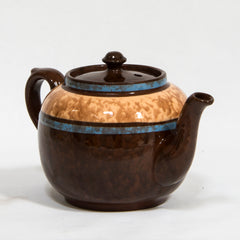 A  striking 3-4 cup original vintage Brown Betty teapot with striking blue marbled banding. Original Brown Betty teapots are distinguished by two common characteristics: their red Etruria Marl clay, and a rich brown manganese glaze known as Rockingham. The clay is unique to Stoke-on-Trent, Staffordshire, UK.