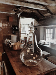 A large and impressive hand-blown glass apothecary’s carboy with facetted crystal glass stopper from K H Emeleus Chemist & Druggist of Battle, Sussex. This exceptional carboy would have stood pride-of-place in their late 19th century chemist’s windows, filled with coloured liquid, standing as the eye-catching trademark for this chemist’s dispensary.