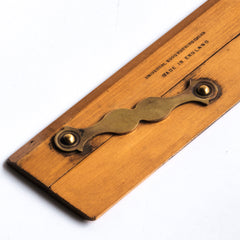 Draughtsman's parallel rule with brass hinges and imprinted with "Universal Wood Working Co Ltd Made in England - Warranted Best Box": £58 Length 31cm Width 5.5cm Thickness 0.5cm