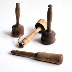 A collection of antique turned wooden treen pestles with beautiful patina and all visually very pleasing.