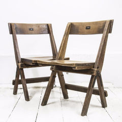 Very good-looking cricket pavilion chairs, each with a small enamel number affixed to its back (numbers 18 and 20). Each is beautifully constructed of solid beech and designed to fold flat when not in use, and so can easily be stored.