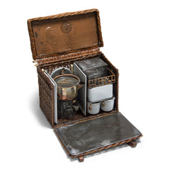 An original Edwardian Drew & Sons En Route tea basket travelling picnic set in white enamel, steel and nickel, with handwoven rattan detailing. Drew & Sons “As supplied to her majesty the queen” (Queen Mary) were the Rolls Royce of picnic set makers, and were originally based in Piccadilly, London – which is where this set was originally retailed. Their picnic sets are rare to find, let alone in such good condition, and are now highly sort after.