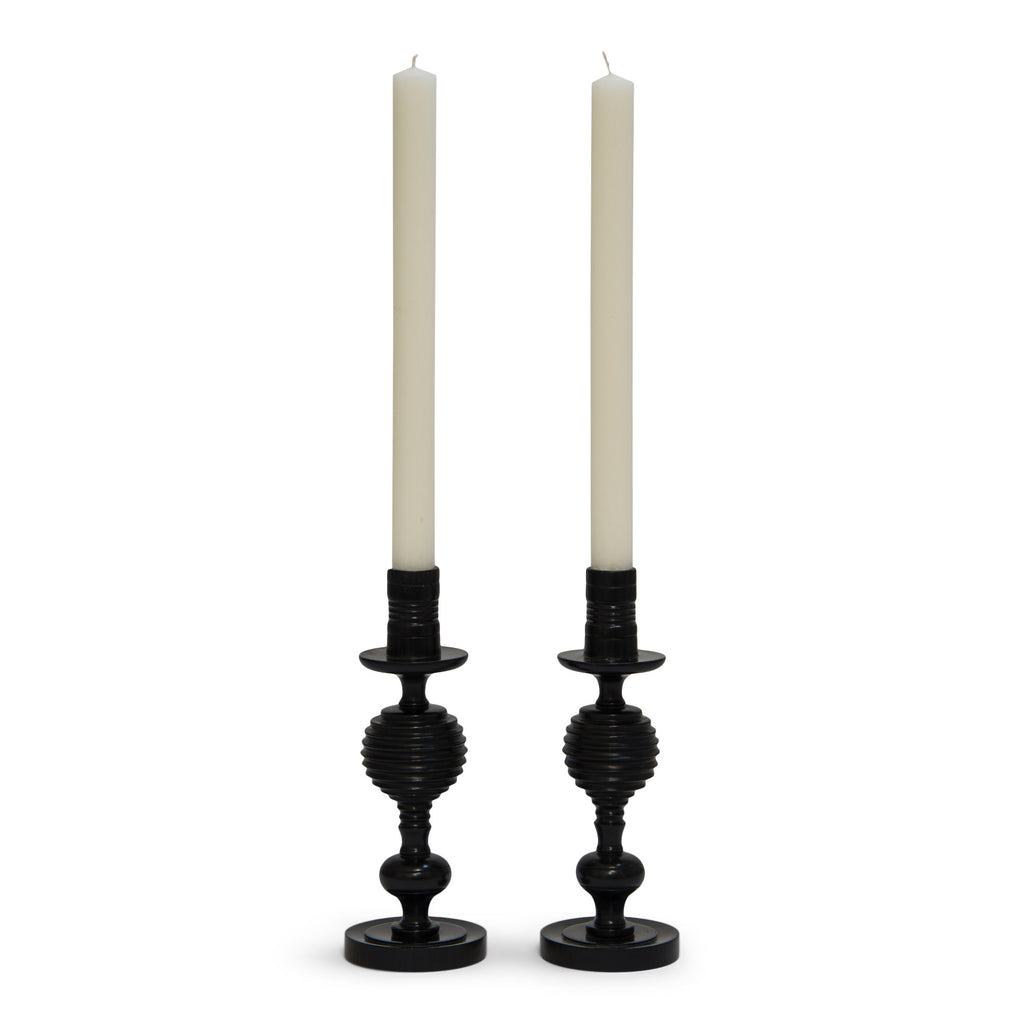A striking pair of 1930s ebony candlesticks, each with turned concave fluting. Most likely made in Africa for the European market.