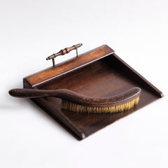 An Edwardian oak and plywood crumb tray with elegant brass handle; complete with its original matching curved crumb brush, crafted from oak and horsehair.