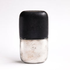 A very handsome Edwardian silver plated, glass and black leather 1/2 pint hip flask with a screw-cap top by "James Dickson & Sons Sheffield". The clear glass body is half covered with leather, the upper half has a detachable silver plated cover that also acts as a cup.