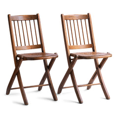 We have a run of these elegant Edwardian folding chairs, which were purchased some years back directly from the church hall in Winchelsea, East Sussex, UK. The seats are of ply with a pierced star pattern; the backs spindle slatted and each frame is beautifully constructed from solid walnut and designed to fold flat.