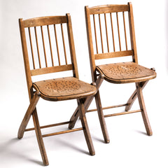 We have a run of these elegant Edwardian folding chairs, which were purchased some years back directly from the church hall in Winchelsea, East Sussex, UK. The seats are of ply with a pierced star pattern; the backs spindle slatted and each frame is beautifully constructed from solid walnut and designed to fold flat.