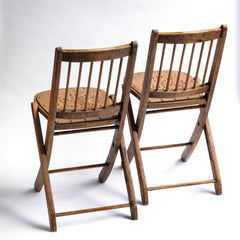 We have a run of these elegant Edwardian folding chairs, which were purchased some years back directly from the church hall in Winchelsea, East Sussex, UK. The seats are of ply with a pierced star pattern; the backs spindle slatted and each frame is beautifully constructed from solid walnut and designed to fold flat.