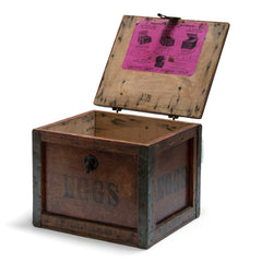 A very handsome 1920s egg travelling box, recently purchased from a farm sale in Hertfordshire, UK. The lid, and all four side panels are stencilled "Eggs", and various extra stamps, as shown in the images. It has a bracket hinged lid with carrying handle, reinforced metal trim corners, and a hasp. Inside the lid it still has its original maker's paper label, applied by the "Dairy Outfit Company Ltd, Kings Cross, London N1".