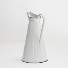 A good-looking large white enamel water jug with black enamel trim to its rim and base.   Year of manufacture: c.1930 - 1950  Origin: England   Material: enamelware  Height: 155cm  Diameter: 26cm  Diameter from spout to handle: 31cm