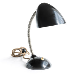 A stunning 1940s Bakelite lamp with flexi-arm designed by British designer Eric Kirkman Cole. It emits good directional light and so is ideal for the desk or the bedside table.