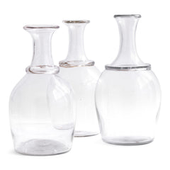 A collection of three very handsome handblown Georgian water carafes