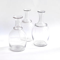 A collection of three very handsome handblown Georgian water carafes