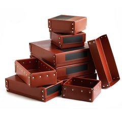 A collection of Vintage ex-museum archive boxes c.1950 made from vulcanized cardboard with internal aluminium frame and rivets for extra rigidity. The boxes were specially made for a well-known central London museum, yet they were never used, only recently being discovered in a forgotten store room belonging to the museum.