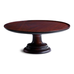 A stunning early twentieth century revolving food stand, most likely made for a food hall or grand hotel dining room. The large circular top is mounted on a stepped plinth-like base; both parts are made from turned solid mahogany. The revolving parts are made of brass, fitted to the underside and to the top of the base, affording smooth operation and continual motion.