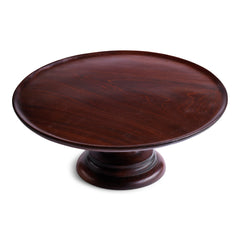A stunning early twentieth century revolving food stand, most likely made for a food hall or grand hotel dining room. The large circular top is mounted on a stepped plinth-like base; both parts are made from turned solid mahogany. The revolving parts are made of brass, fitted to the underside and to the top of the base, affording smooth operation and continual motion.