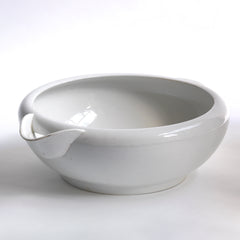 A good large early twentieth century ironstone dairy pouring bowl with roll-top rim and cupped handle by Grimwade, marked to the base 'The "Grimwade" Safety Milk Bowl patent no. 5381/09 registered shape no. 537320'.