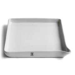 This ceramic ironstone photographic developing tray was made by Granitine, a Victorian manufacturer of porcelain darkroom products. Today it can be repurposed for kitchen use, used as a tray, or as a stand for plants.  The makers stamp can be seen on the front end of the tray.