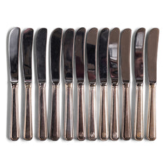 Vintage hotel ware silver-plated WMF butter knife, made for Holland & America Line, the cruise liner company. Each is marked WMF and the tip of the fork handles bear the hallmark Holland & America circular crest, the Art Deco stylised prow of a large transatlantic steamship.