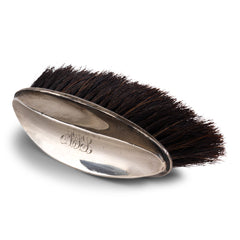 A good-looking and tidy little clothes brush with sterling silver handle monogrammed with the initials "A J S" dating to the 1920s. The elegant scooped handle is designed for ease of holding, and is hallmarked with a lion, and will fit comfortably into your bag or briefcase.