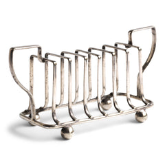 An Edwardian twin handled silver plated toast rack with ball feet.