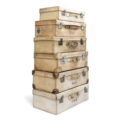 A collection of glamorous 1920s vellum luggage made from bleached cowhide and fitted with nickel plated fittings. One can but wonder what grand tours and travels they have seen. Their travels are over, yet now they are perfect for bedroom blanket, clothes or shoe storage, and make very handsome low level coffee-tables.