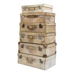 A collection of glamorous 1920s vellum luggage made from bleached cowhide and fitted with nickel plated fittings. One can but wonder what grand tours and travels they have seen. Their travels are over, yet now they are perfect for bedroom blanket, clothes or shoe storage, and make very handsome low level coffee-tables.