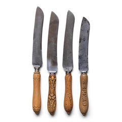 A collection of handsome antique Victorian bread knives with carved sycamore and beech handles, and carbon steel engraved blades - one with carved "Bread" handle.