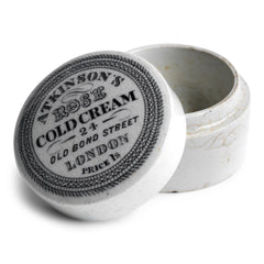 The lid of this cold cream pot is exquisitely designed and bears all of the proprietor's information in black and white: "Atkinson's Rose Cold Cream - 24 Old Bond London - Price 1s" with "Too Good Patent London" on the underside.