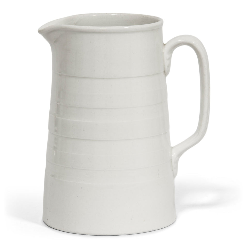 A good early twentieth century ironstone water jug with incised banding. These are getting much harder to find these days, and this one is in excellent condition.  Year of manufacture: 1910 Origin: England Material: Ceramic ironstone Height 18.5cm Diameter 12.5cm Diameter handle to spout 15.5cm Condition: excellent