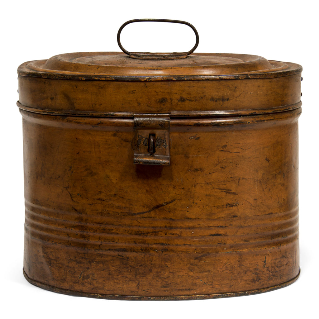 A very handsome Victorian hat tin with hinged lid, carrying handle, hasp, and original burnt umber painted finish. The interior paint is also original and is a vivid cobalt green. It has a delicious patina - its toffee-ness makes you want to eat it!