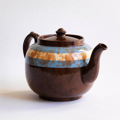 A rare colour-way 6 cup original Brown Betty teapot with blue and white marbled banding.