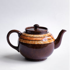 A very handsome 4 cup original vintage Brown Betty teapot with three toffee coloured marbled bands.