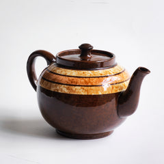 A very handsome 4 cup original vintage Brown Betty teapot with three toffee coloured marbled bands.