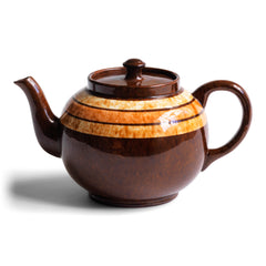A very handsome 4 cup original vintage Brown Betty teapot with three toffee coloured marbled bands.